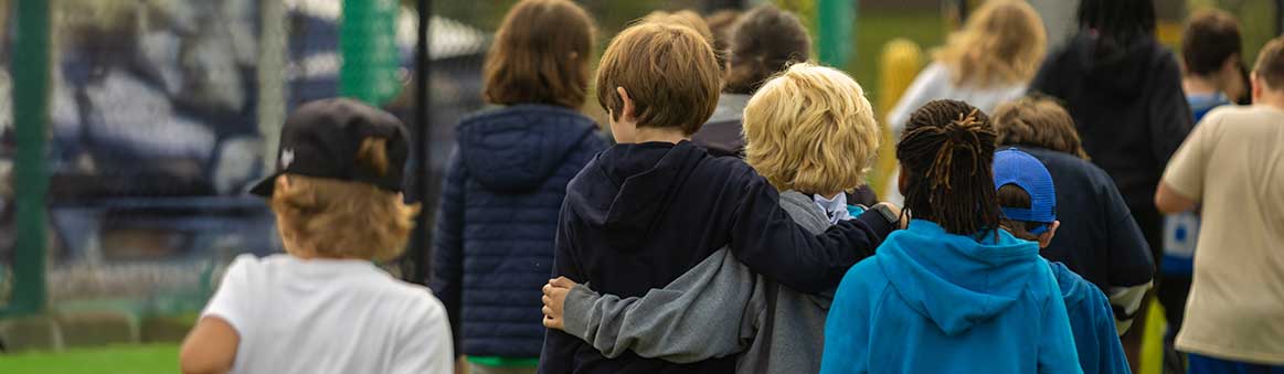 Kids walking together at Night to Unite